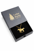 Gold horse pendant necklace in a Cedar Roots gift box