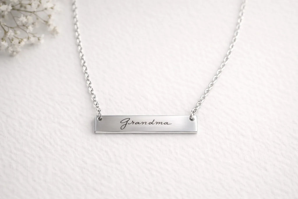 Silver bar necklace engraved Grandma in script lettering
