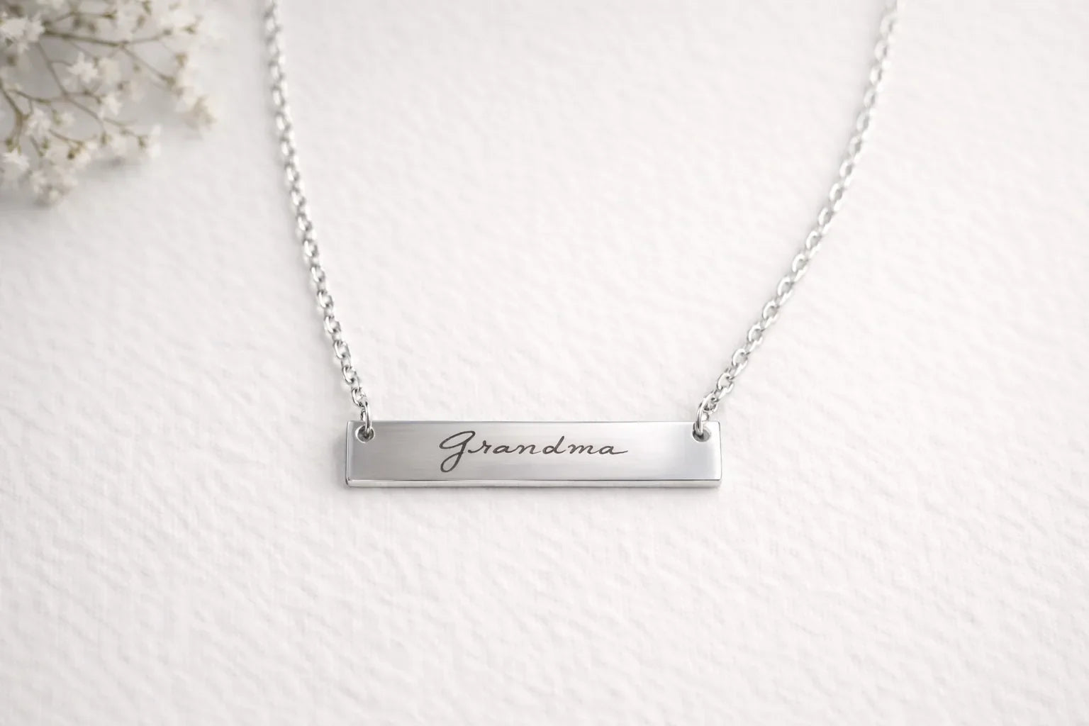 Silver bar necklace engraved Grandma in script lettering