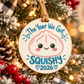 a christmas tree decoration with a tag and pine cones