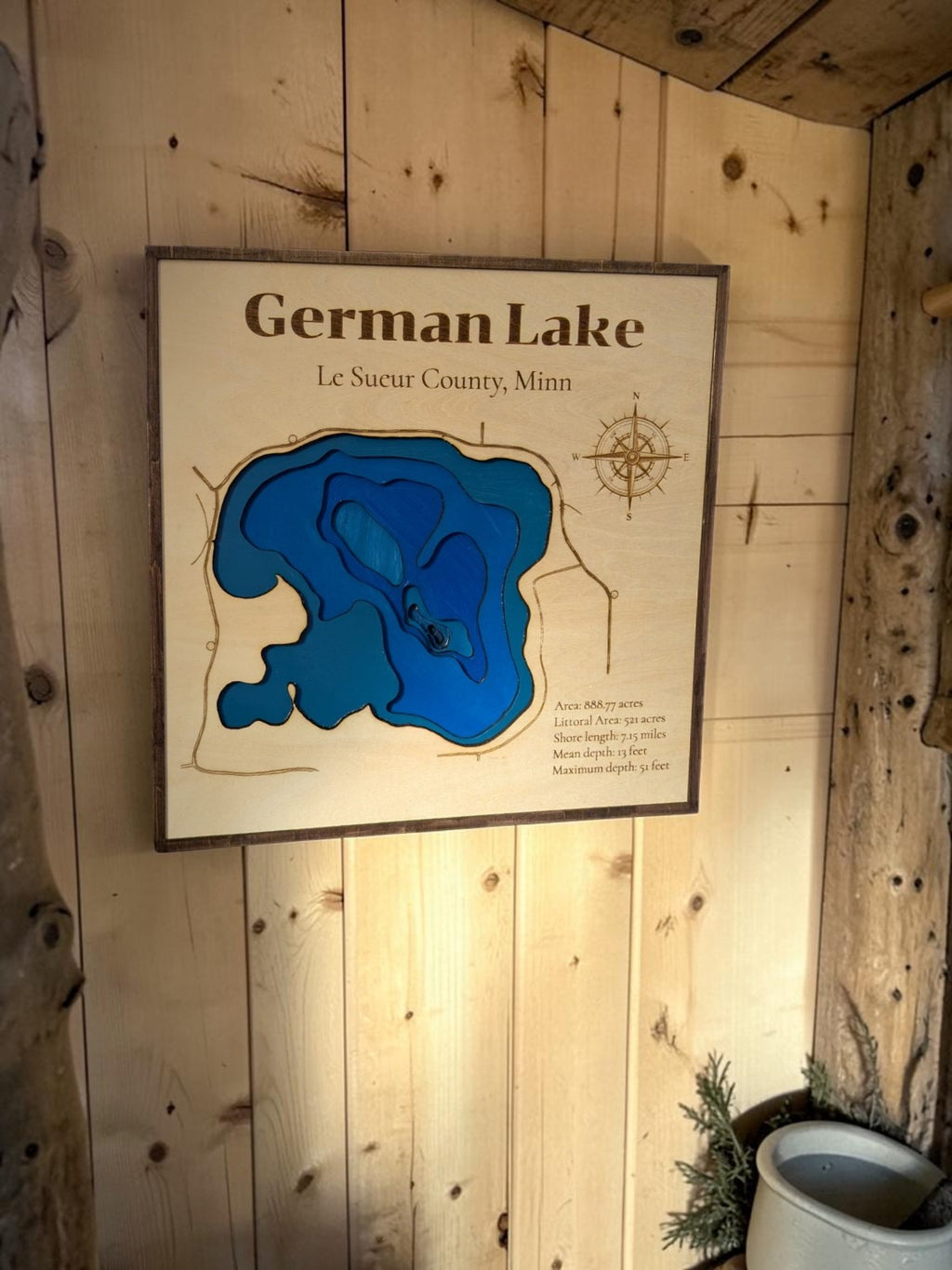 Layered German Lake depth map on a wood plank wall