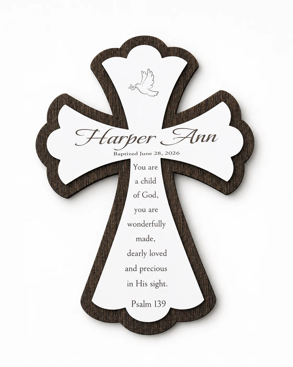 Engraved name style — white wood cross on a dark wood base, engraved with the child's name, baptism date, and Psalm 139