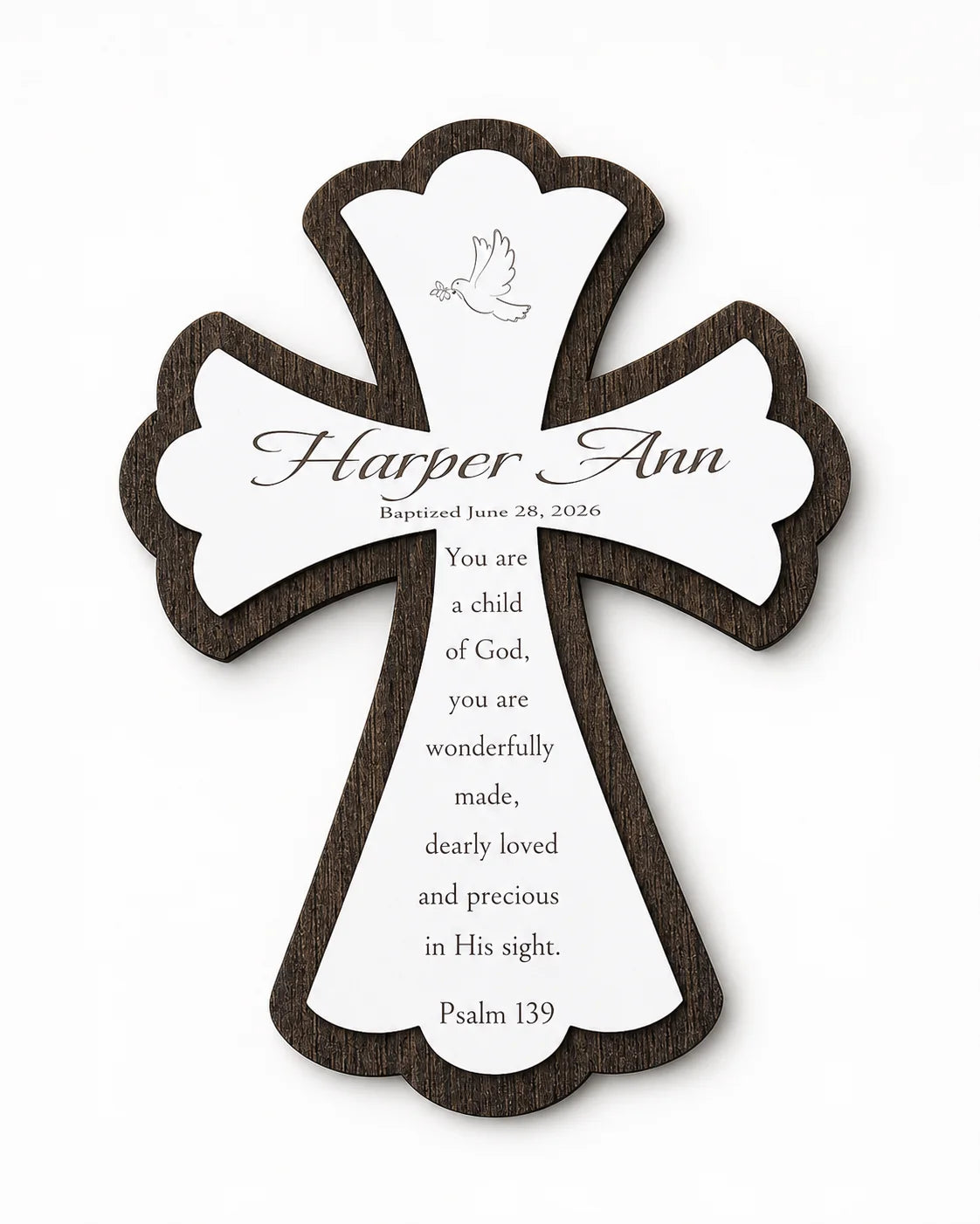 Engraved name style — white wood cross on a dark wood base, engraved with the child's name, baptism date, and Psalm 139