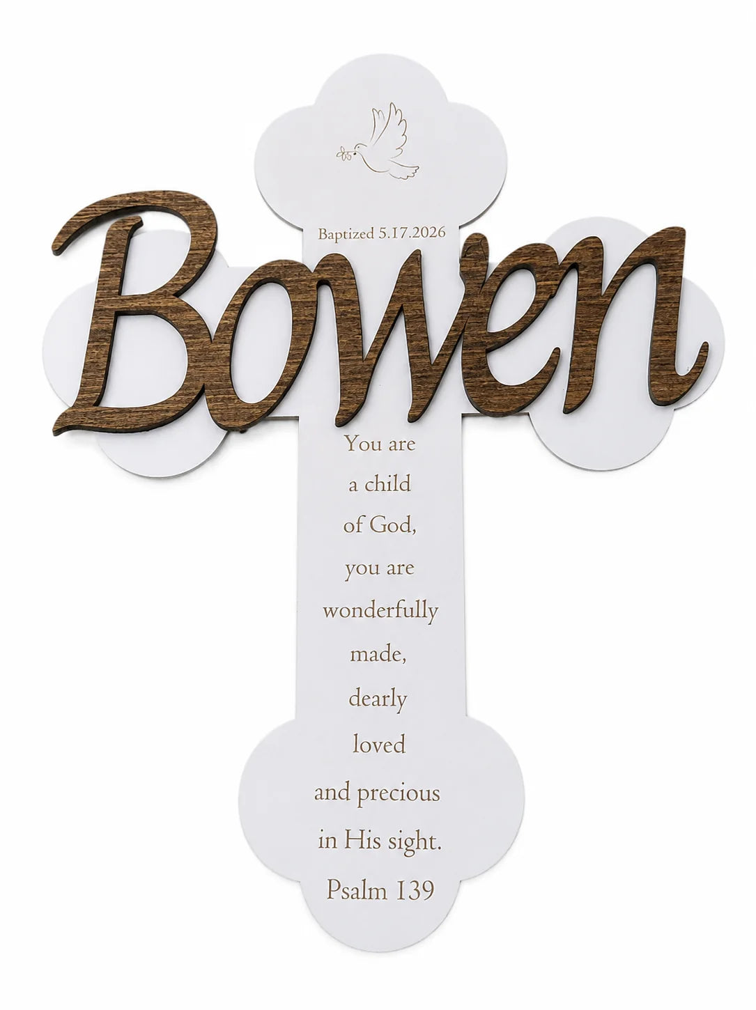 Wood script name style — child's name cut from dark wood in script lettering, layered over a white cross with Psalm 139